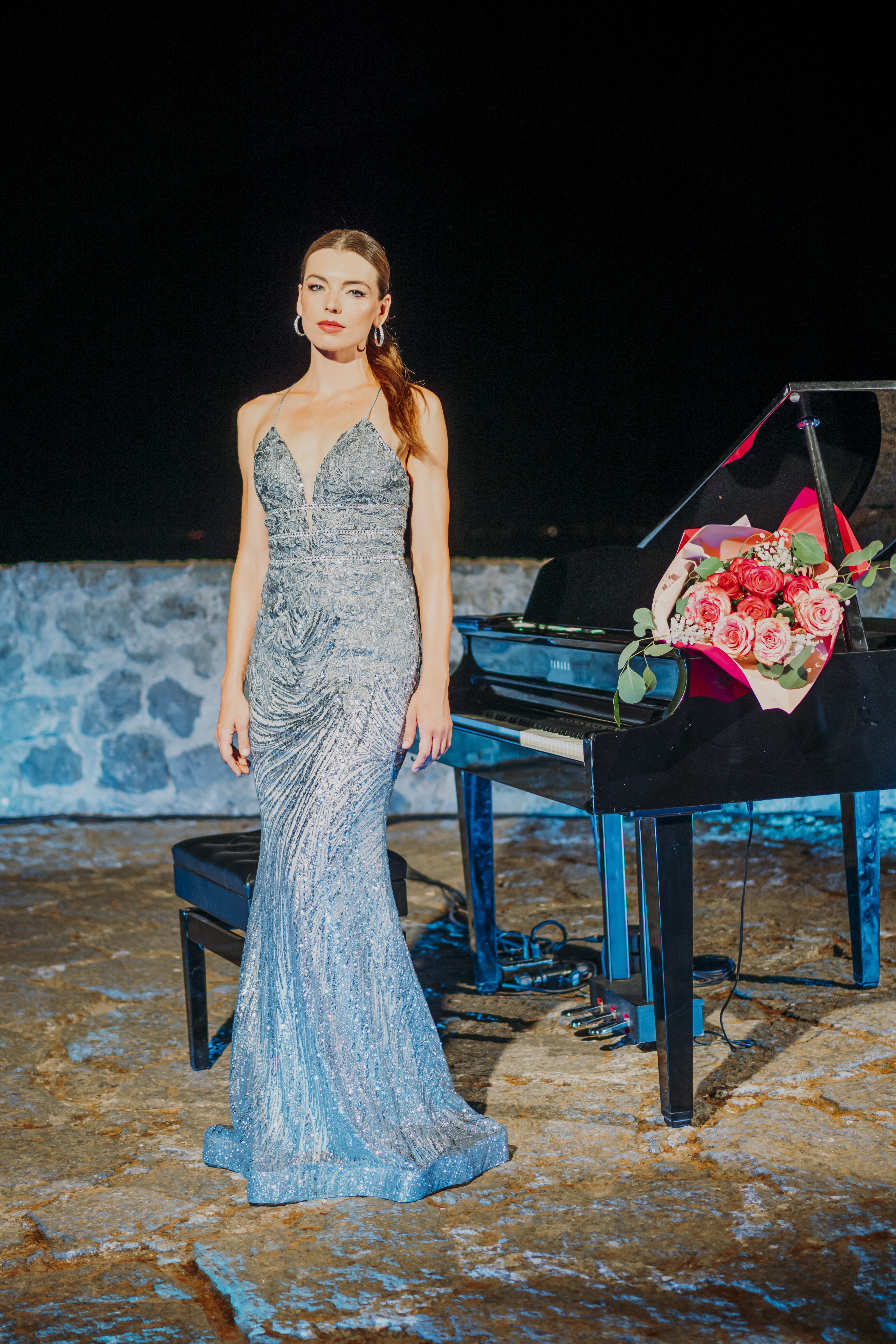 Event pianist Diana Rotari in elegant gown at private luxury gathering